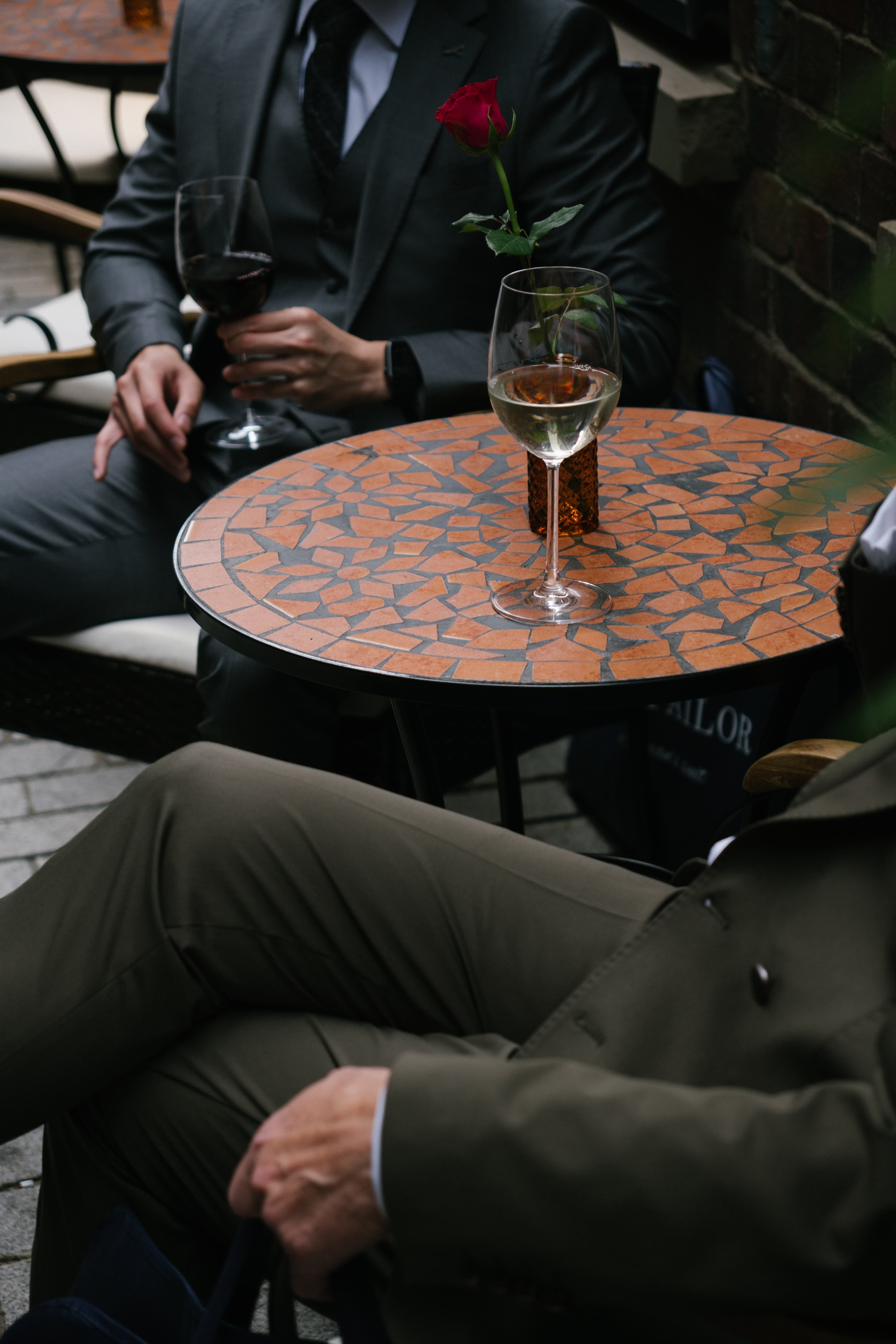 Table with rose and wine