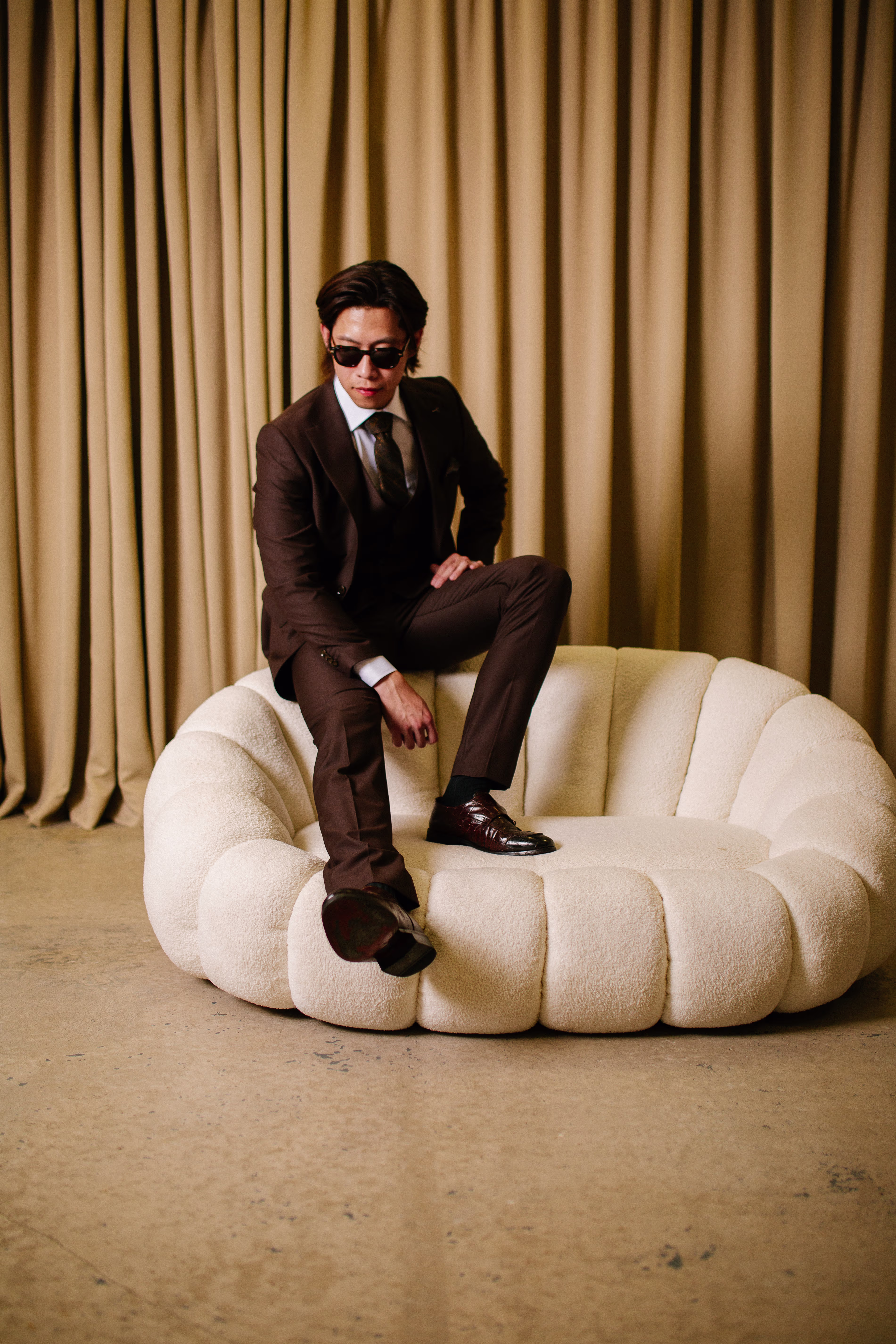 Moses on sofa in suit